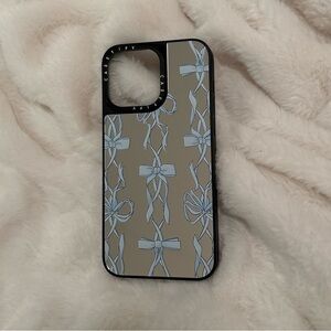 Casetify Black and reflective Phone Case with Blue Ribbon Design iPhone 15 pro